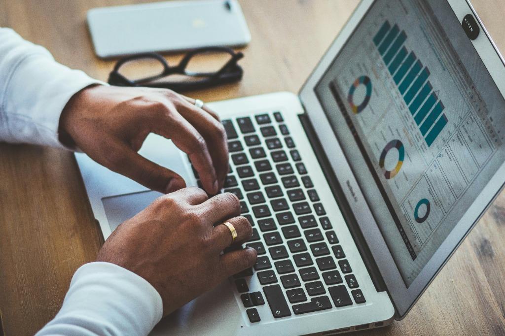NexusBOS ERP executive business intelligence dashboard and analytics on laptop