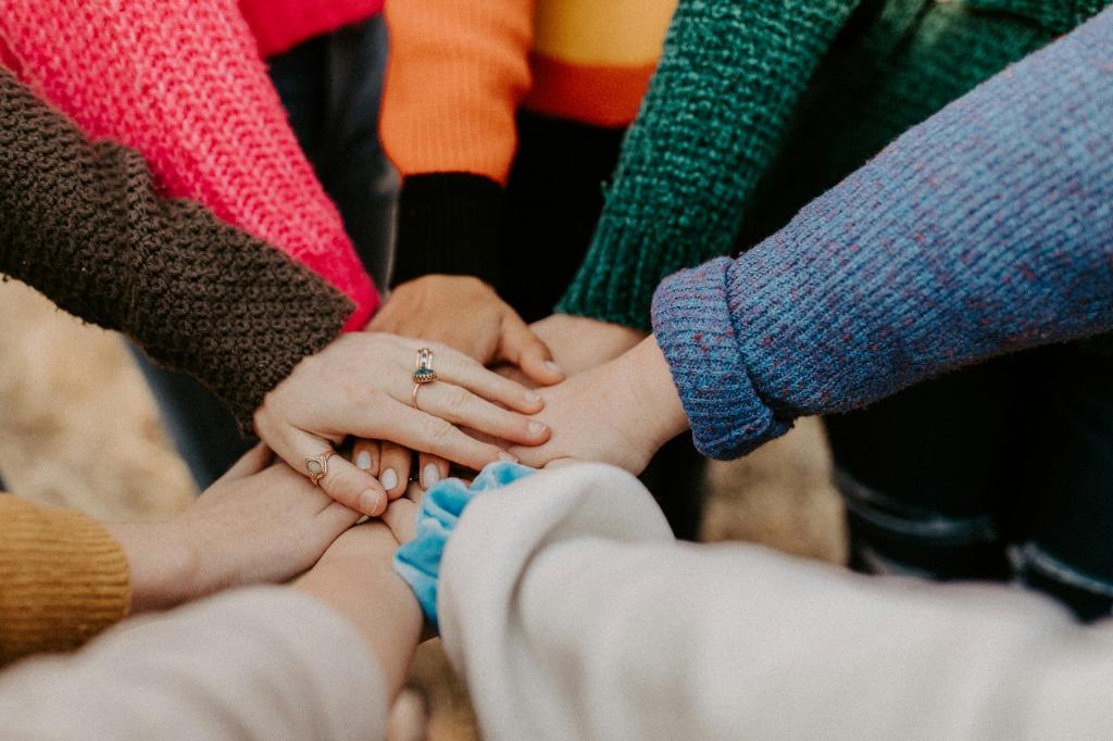 NexusBOS engineering and customer support team hands collaborating